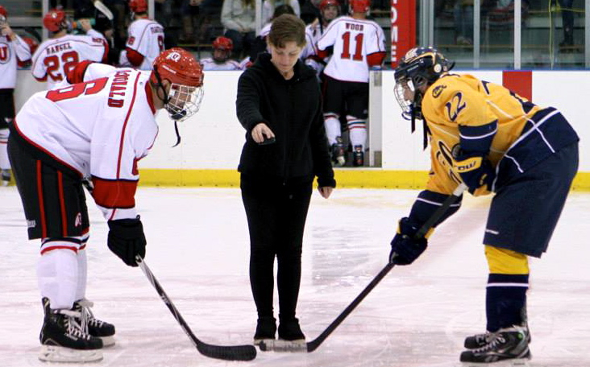 University of Utah student Annika Pecchia-Bekkum, a Gates Cambridge Scholar for 2014, shown receiving another honor--dropping the puck at a Utah vs. UC Berkeley hockey game.