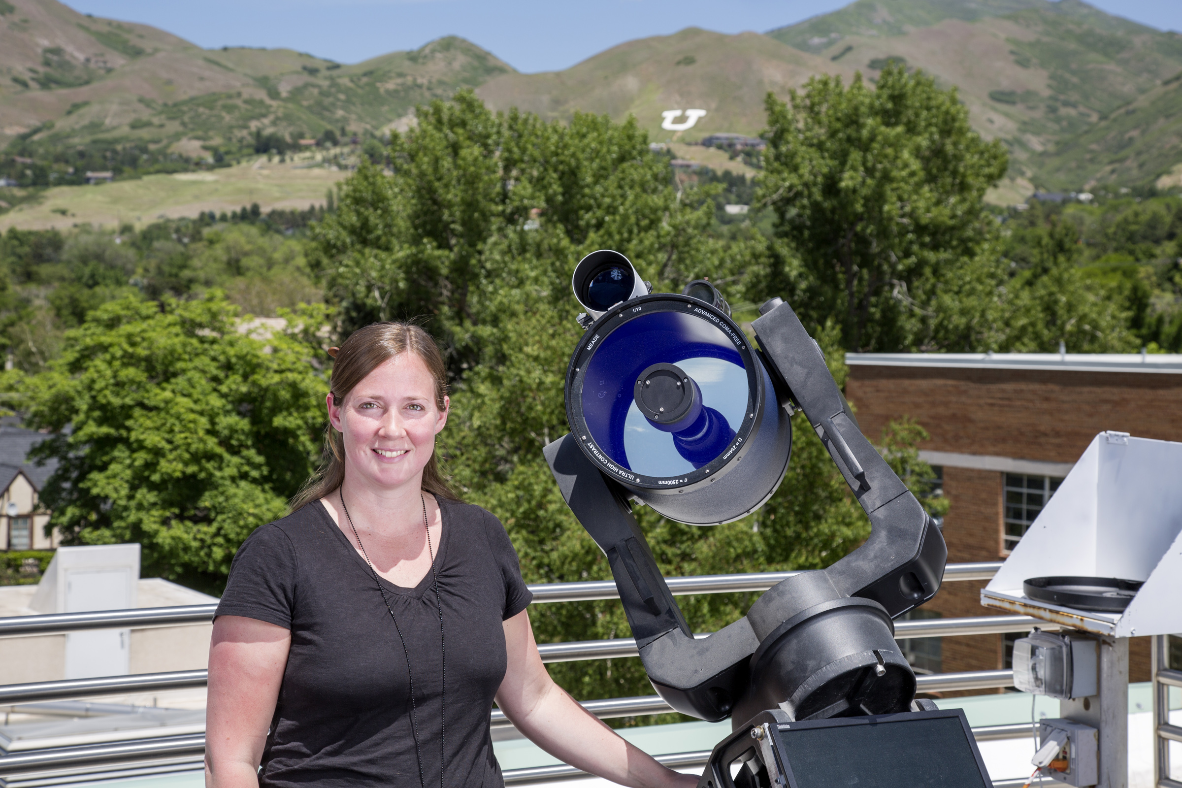 Tabitha Buehler, Assistant Professor (Lecturer). Coordinator of the new outreach center and head the AstronomUrs outreach team, next to one of five Meade 10" LX200 ACF telescopes also available at the South Physics Observatory.