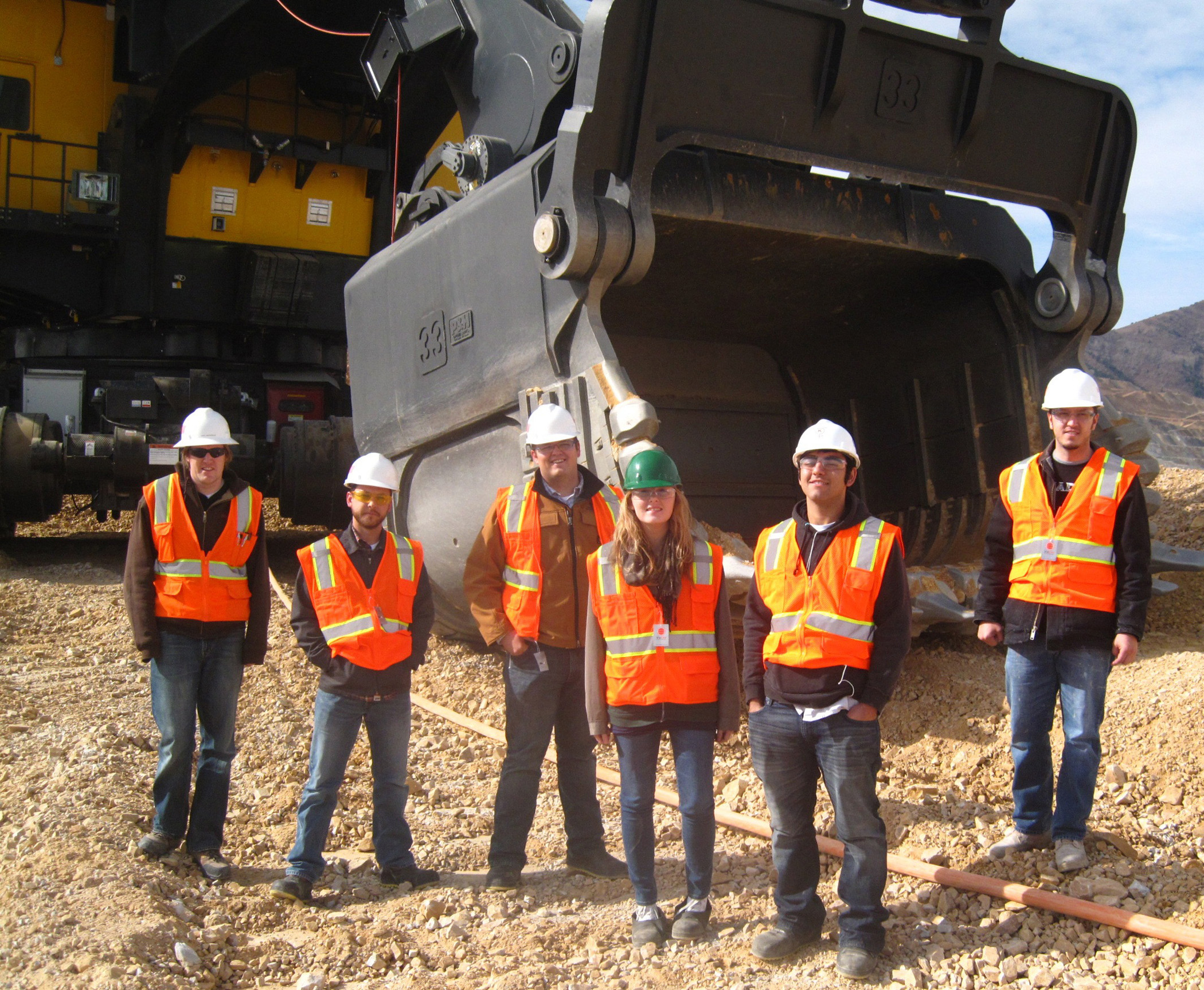 University of Utah mining engineering students with giant mining equipment at Rio Tinto-Utah Kennecott Copper’s Bingham Canyon Mine on the southwest edge of the Salt Lake Valley. The university is establishing a new Center for Mining Safety and Health Excellence to help people who depend on the mining industry.