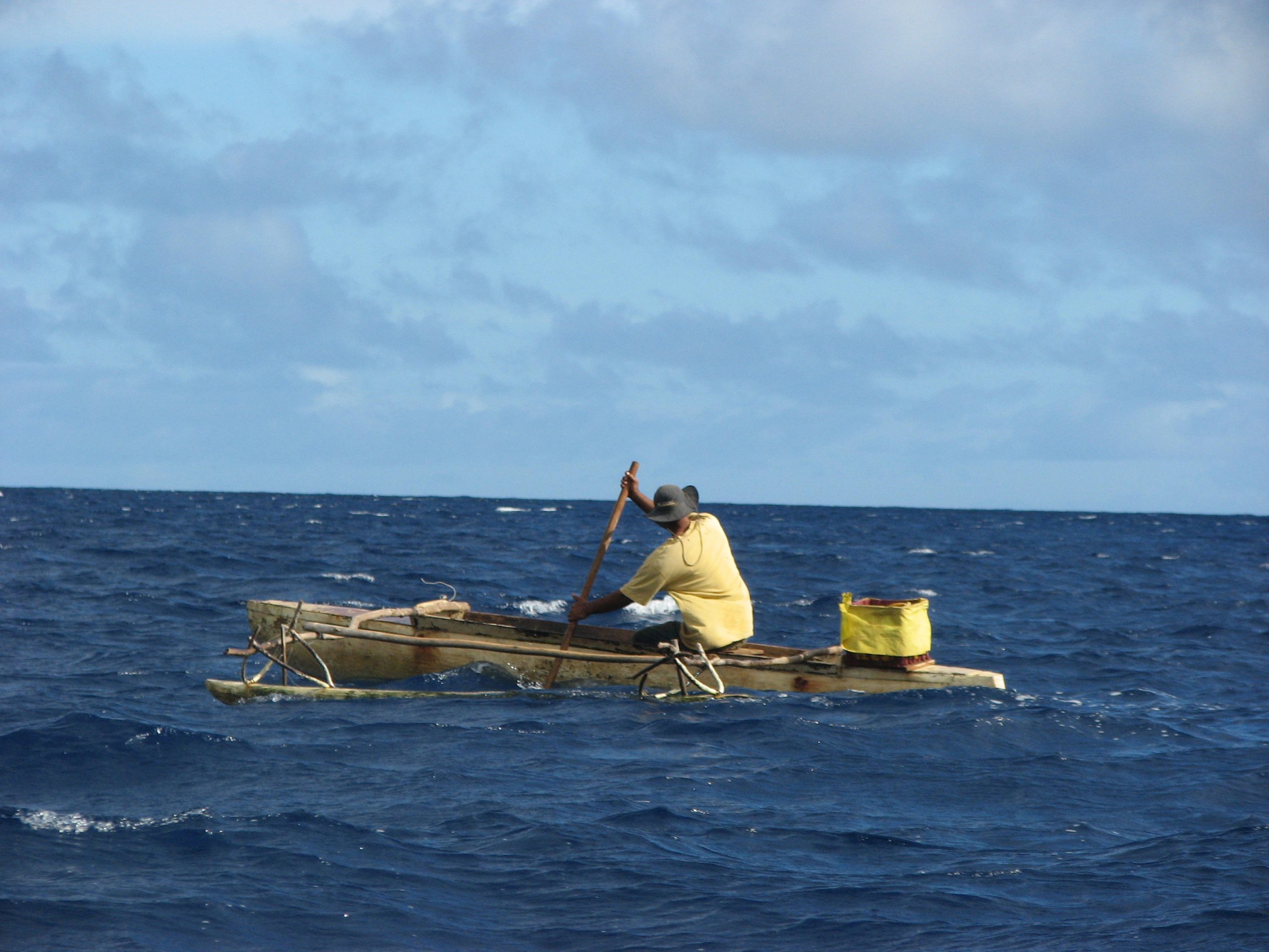 A canoeist paddles between the islands of Vava’u, Tonga. A new University of Utah study uses mathematical modeling to get a better idea of the strategies employed by early seafarers when they used outrigger canoes to settle the islands of the vast Pacific Ocean between 3,500 and 900 years ago.