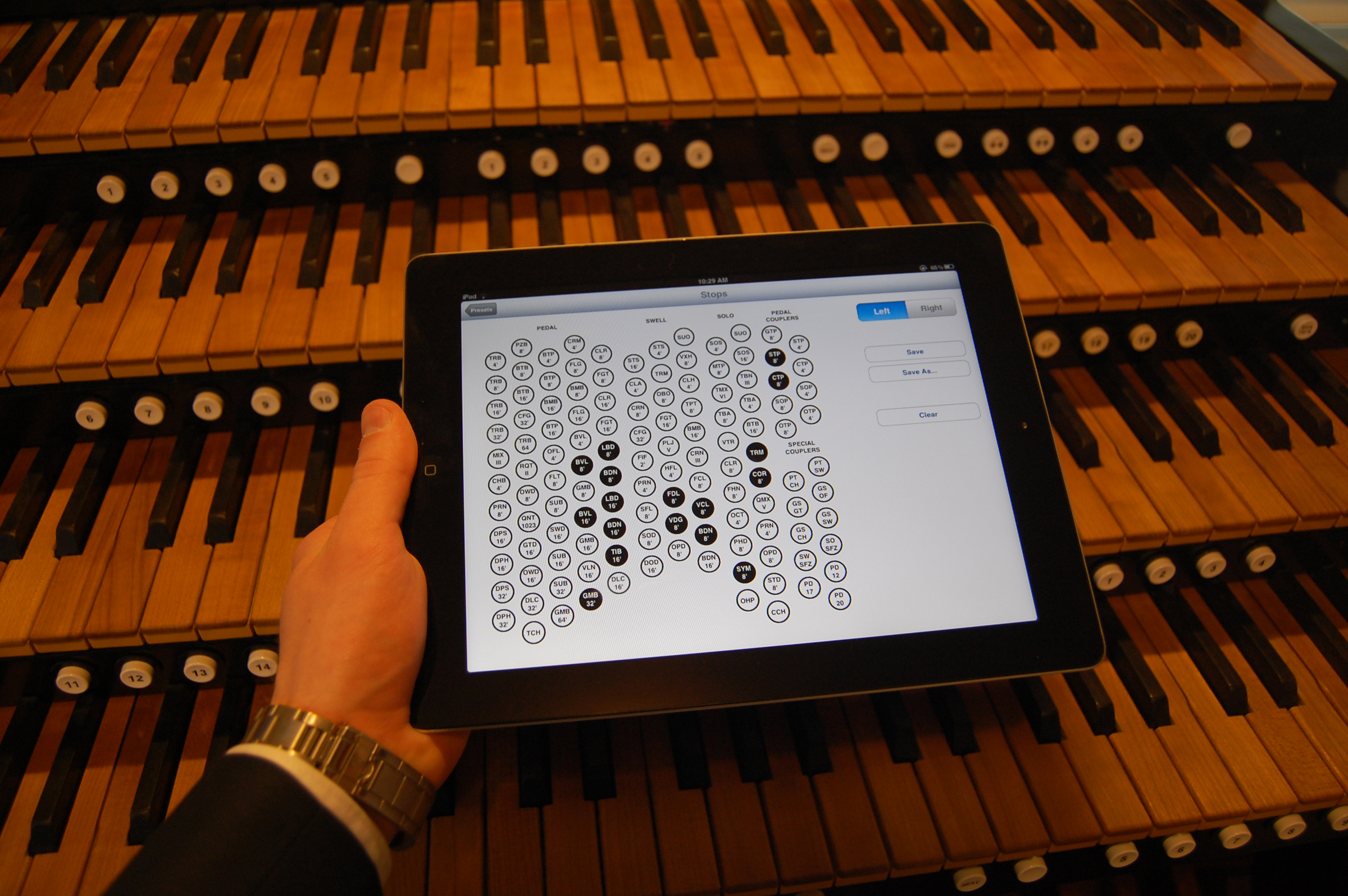 University of Utah computer science student Rob Stefanussen holds an iPad displaying an "app" he developed to record the settings on church pipe organs. It is among about 30 apps developed by students in a class on iPhone and iPad programming.