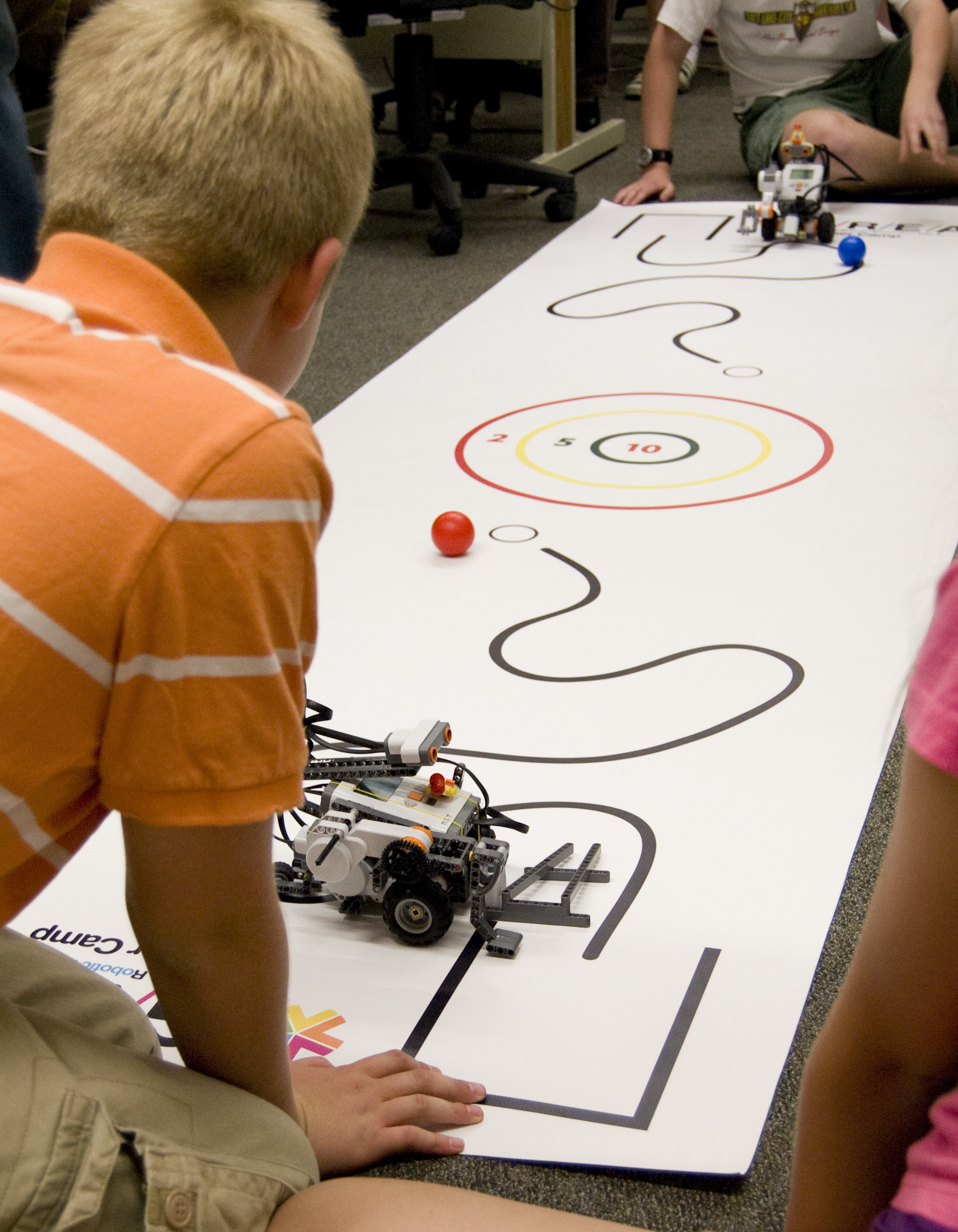 The University of Utah's School of Computing hosts camps every June and July where elementary, middle and high school students learn to program computers, build robots and create animation. Here, a student readies his robot for head-to-head competition in a First Lego League camp.