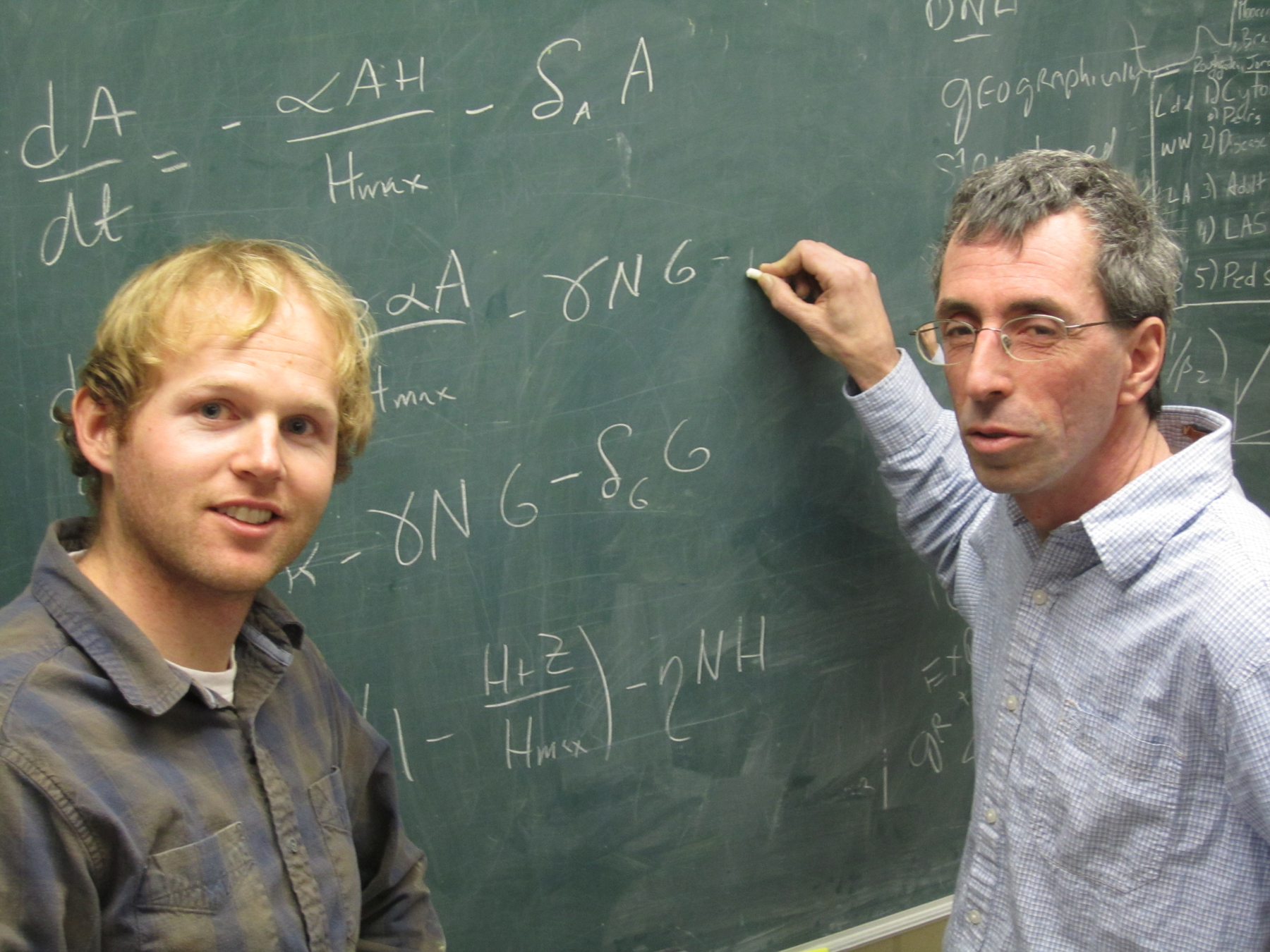 University of Utah mathematicians Chris Remien and Fred Adler with some of the calculus equations that are part of a new method they developed and tested to make it easier for doctors to save Tylenol overdose patients by quickly determining if they can be saved with an antidote or will require a liver transplant to survive.