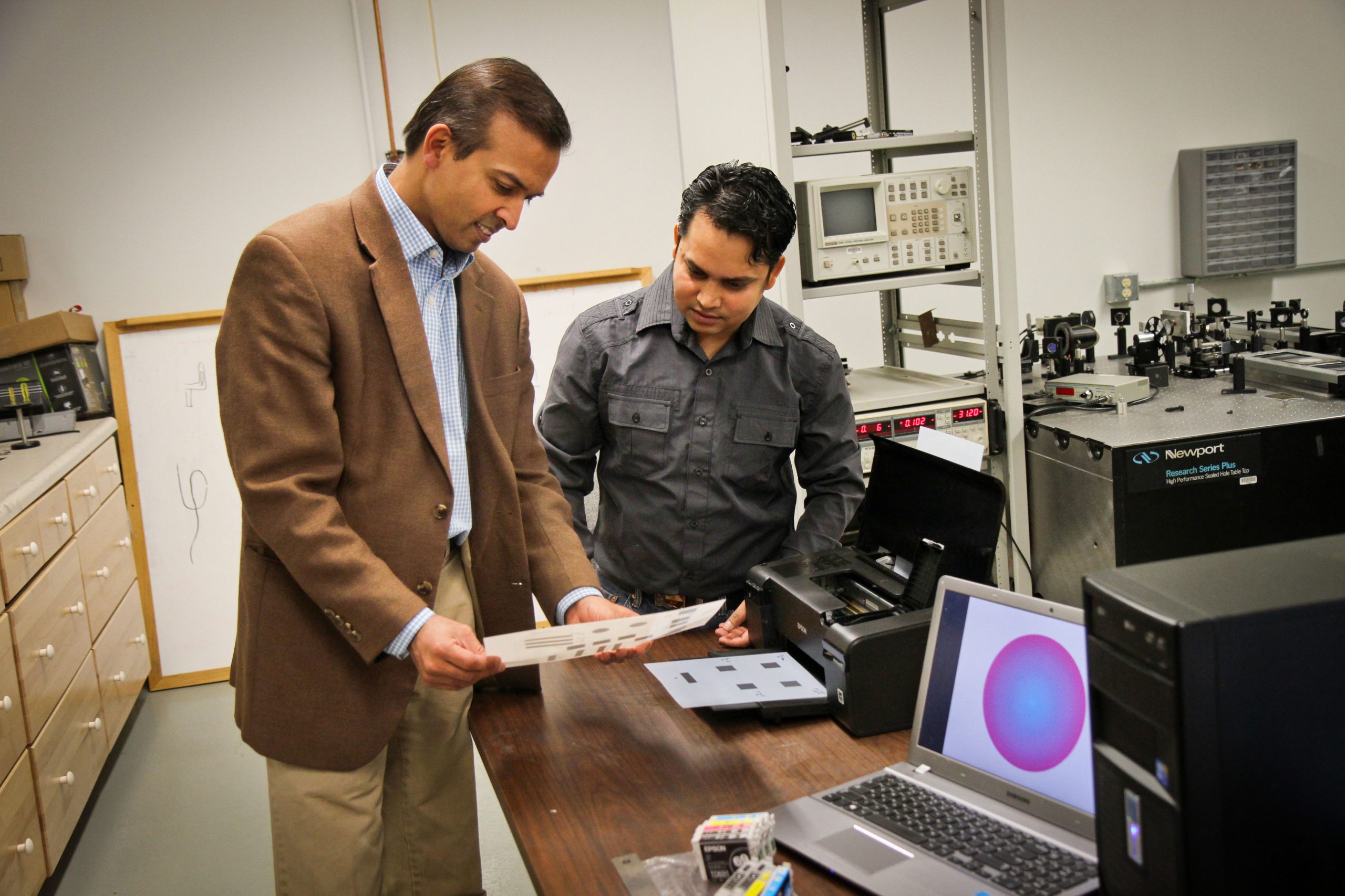 University of Utah electrical engineers Ajay Nahata and Barun Gupta used a $60 inkjet printer with silver and carbon ink cartridges to create a new, widely applicable way to make microscopic structures that use light in metals to carry information. This new technique could be used to rapidly fabricate superfast components in electronic devices, make wireless technology faster or print magnetic materials.