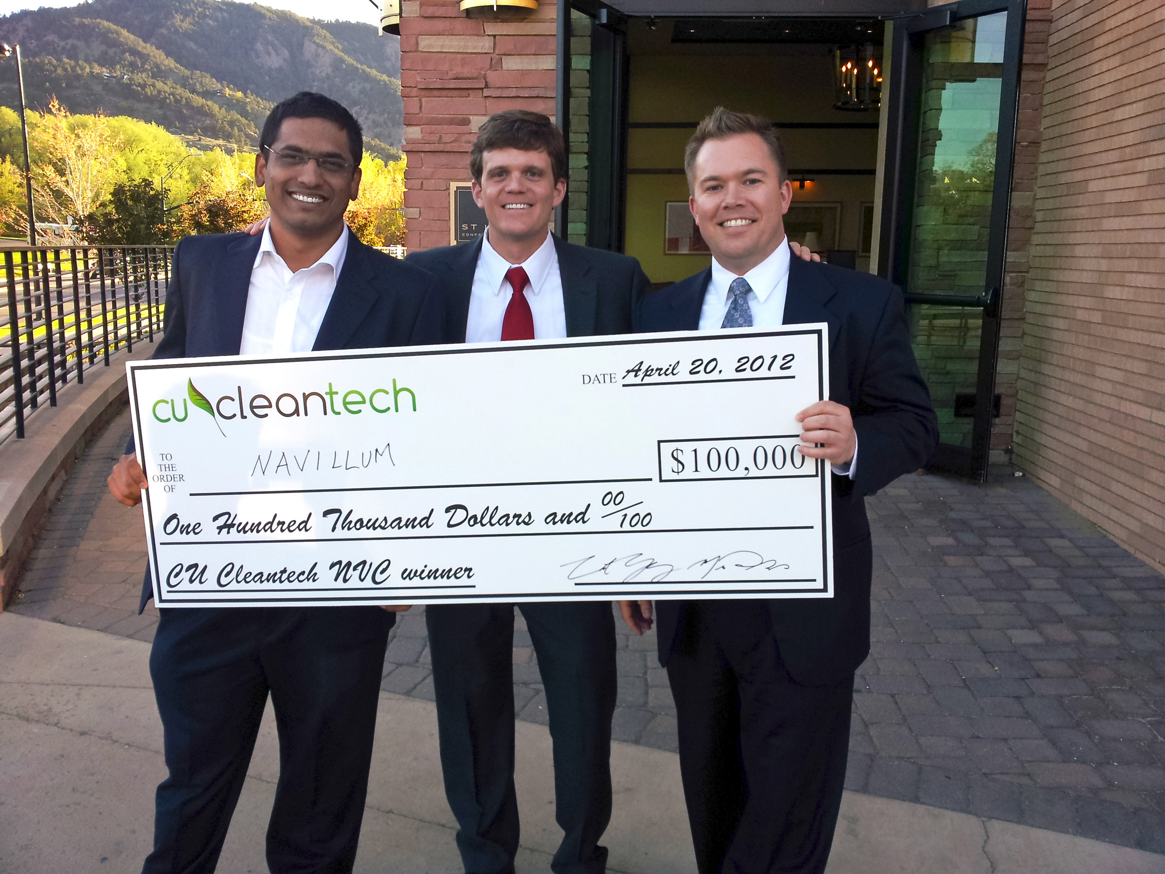 M.B.A. students from the David Eccles School of Business at the University of Utah pose with a $100,000 check they won at the CU Cleantech New Venture Challenge. Picture are, left to right, Ameya Chaudhari, Chris Lewis and Ryan Tucker.