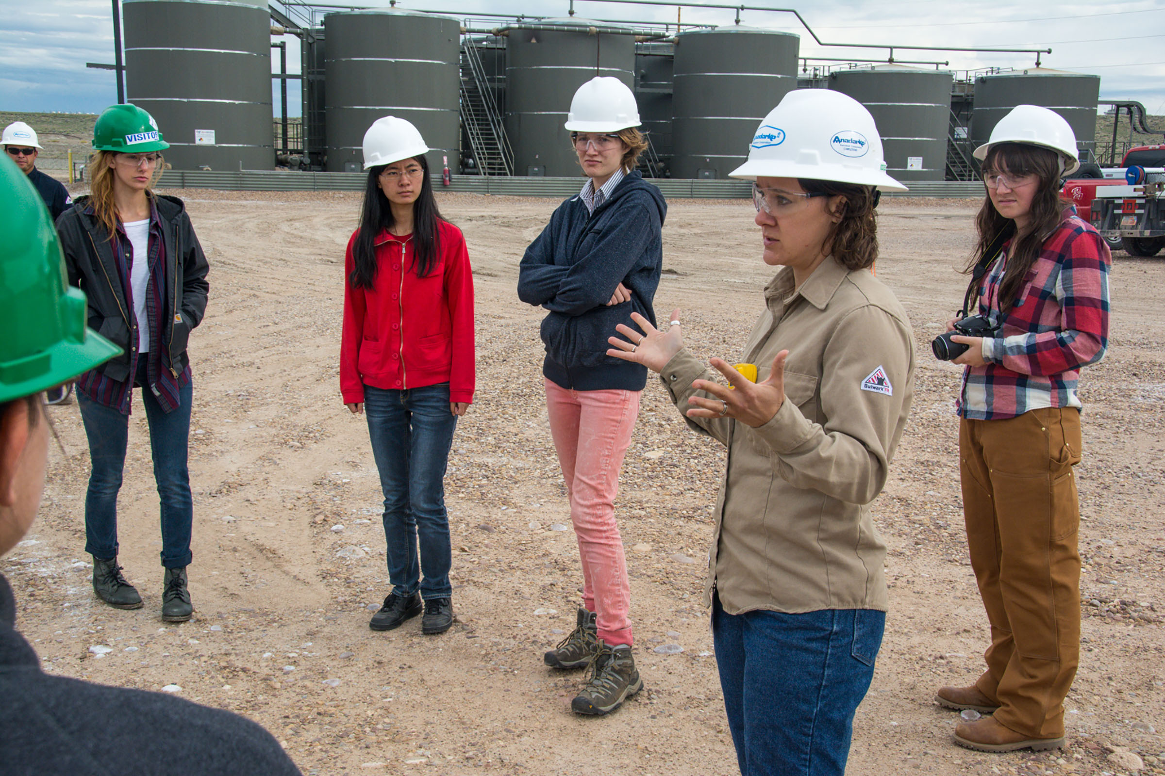 Students (from left to right: Tyler Cain, Runzhi Dong, Isobel Lingenfelter, Christianna Johnson) from the "Air Quality, Health and Society" Honors Praxis Lab receive a tour of the Anadarko natural gas fields outside of Vernal, Utah during their fall 2014 field trip.