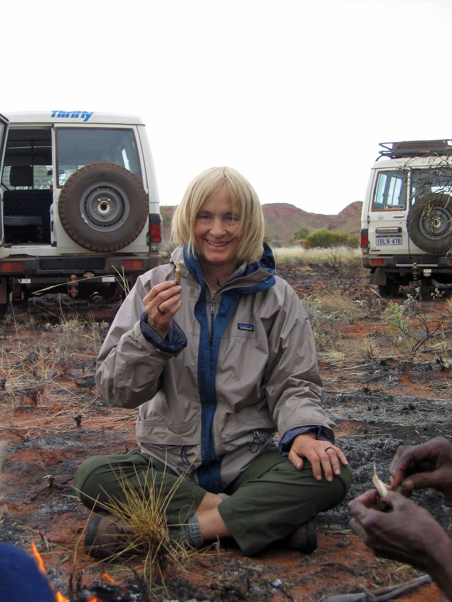 Anthropologist Polly Wiessner eats a lizard during a trip to visit the Mardu aboriginal people in Australia’s western desert. Wiessner is among three University of Utah faculty elected on April 29 to the prestigious National Academy of Sciences.