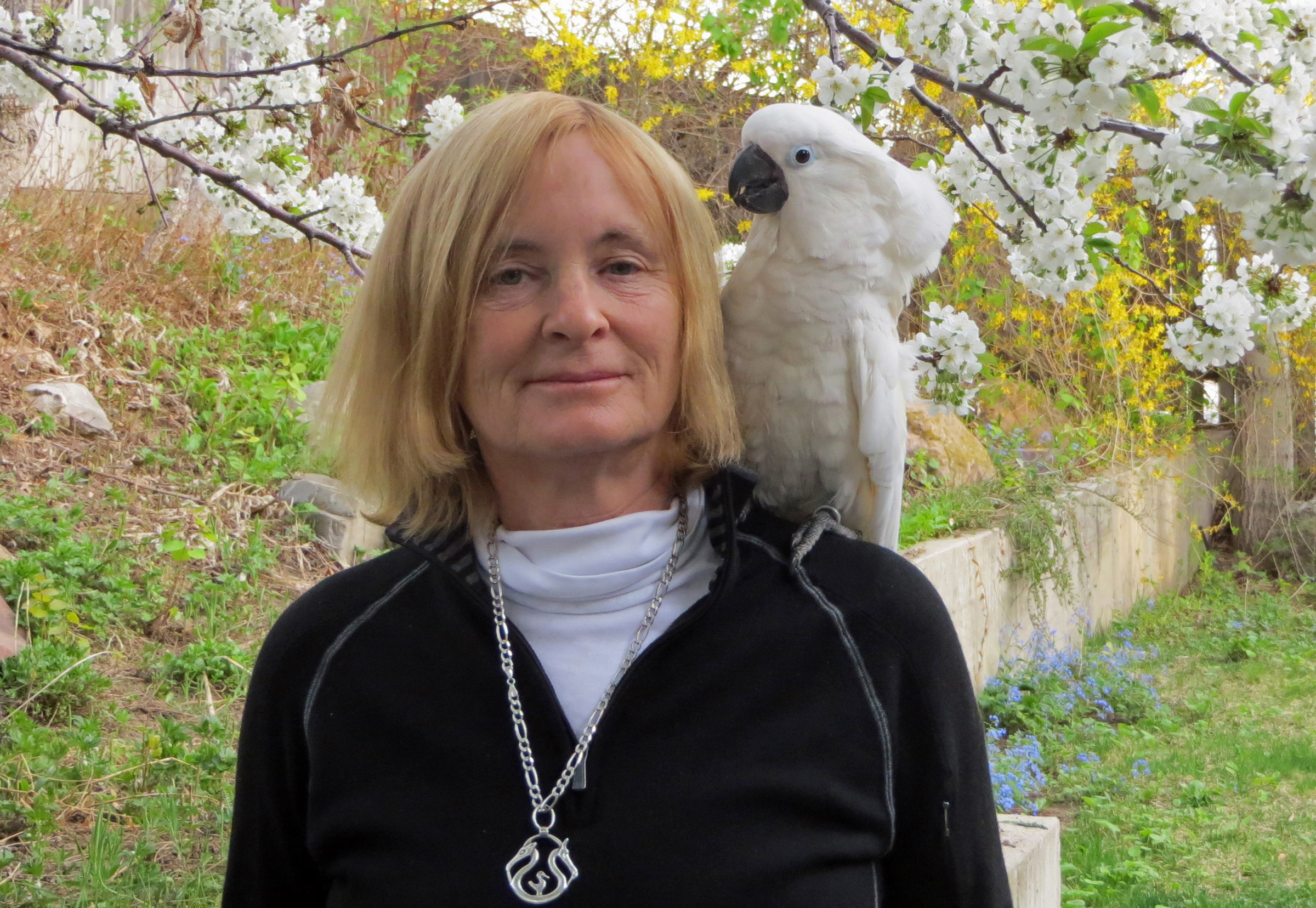 University of Utah anthropology professor Polly Wiessner with Bird, her pet cockatoo.