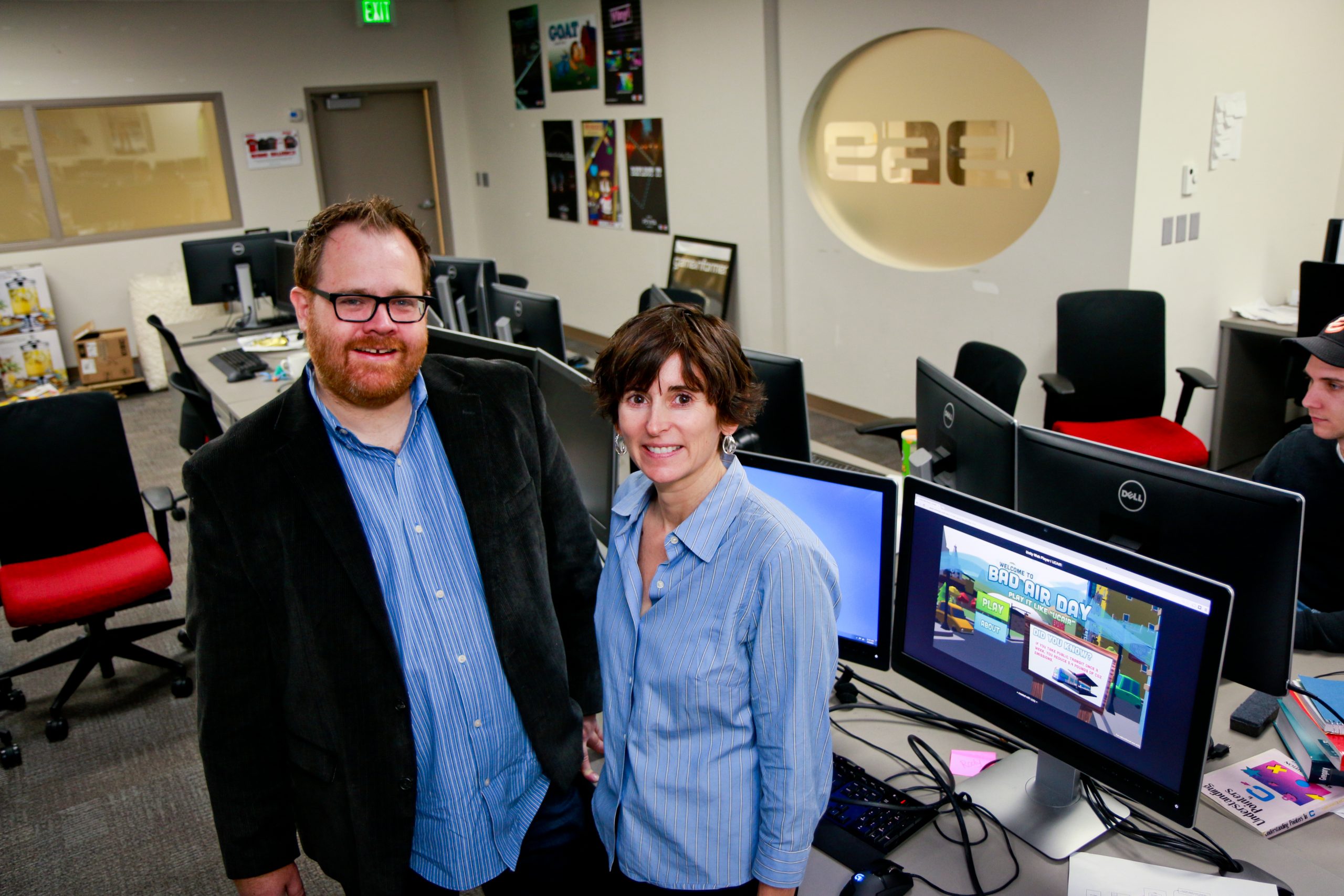 Roger Altizer, EAE Director of Therapeutic Games and Apps (The Gapp) Lab at the University of Utah, left, and Kerry Kelly, a U chemical engineering research associate, have produced “Bad Air Day: Play It Like ‘UCAIR,’” a new video game that teaches high school students about what impacts air quality. Kelly, an expert in air quality, came up with the idea for the game and turned to Altizer and the U’s Entertainment Arts and Engineering video game design program to produce it.