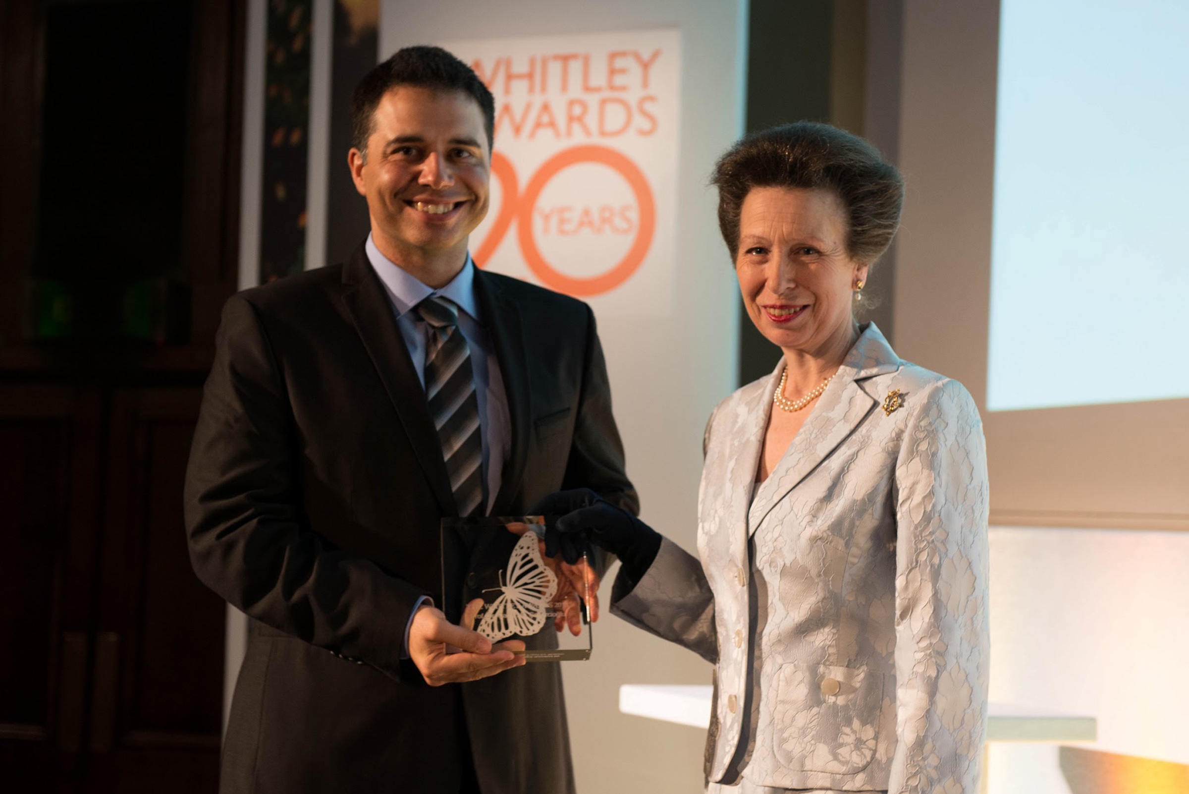 University of Utah biologist Çağan Şekercioğlu accepts the prestigious 20th Anniversary Whitley Gold Award for nature conservation from the United Kingdom's Princess Anne on Thursday, May 2, 2013 during a ceremony at the Royal Geographical Society in London.