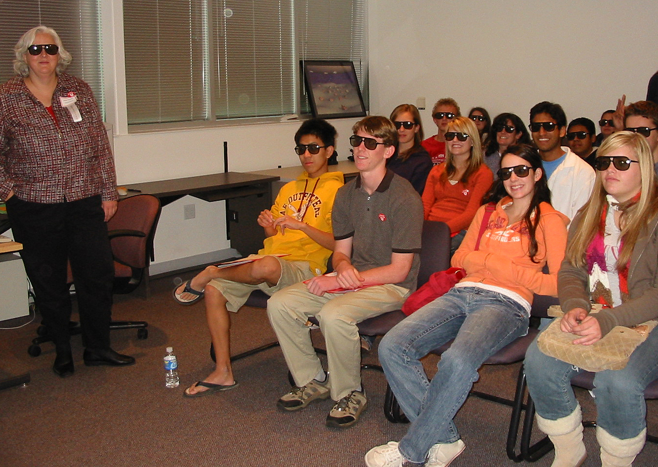 Utah and Idaho high school students wear 3-D glasses, as does staff chemist Anita Orendt, left, during a Science Day at the U demonstration of the visualization capabilities of the University of Utah's Center for High Performance Computing.