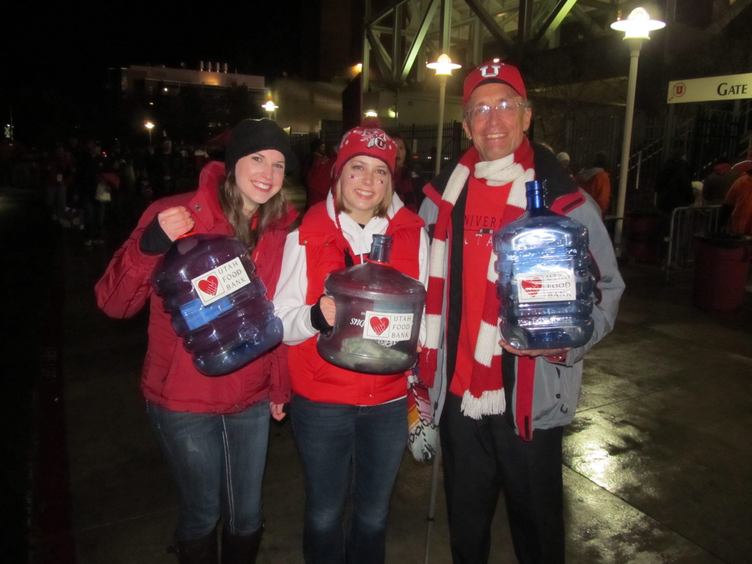 Shelbie Whitchurch, Rachel Kennedy and Steve Gunn collecting donations for food drive.