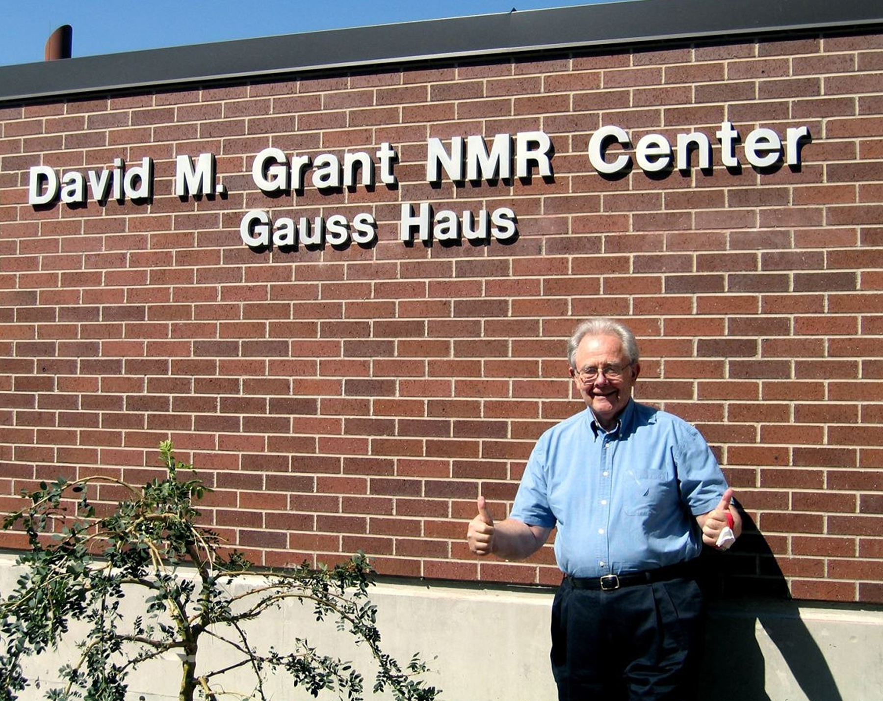 University of Utah chemist David Grant -- a pioneer in the use of powerful magnetic devices and a method known as nuclear magnetic resonance (NMR) spectrometry -- stands in front of the new $14 million NMR center named for him and nicknamed for Carl Friedrich Gauss (1777-1855), a mathematician whose name s used for the units that indicate magnetic field strengths.