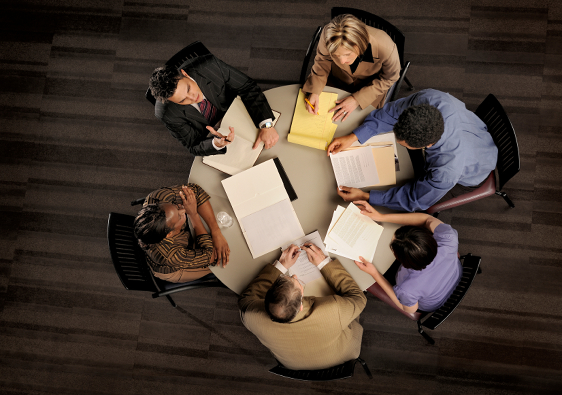 Group of Utah business students involved in problem solving exercise.