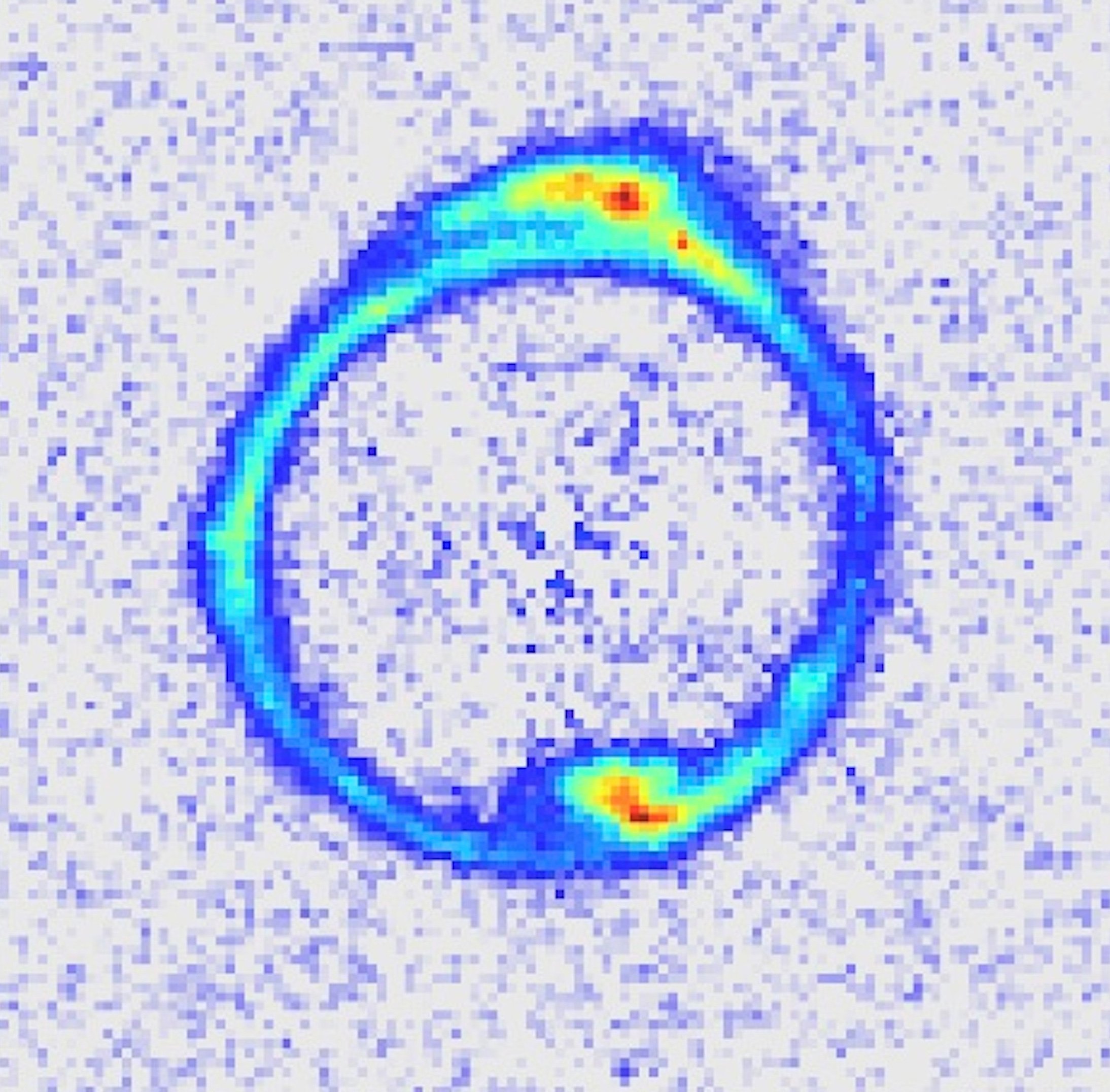 This image, taken by the Hubble Space Telescope, shows a ring of light from a distant galaxy created when a closer galaxy in the foreground – not shown in this processed image – acts as a “gravitational lens” to bend the light from the more distant galaxy into the ring of light, known as an Einstein ring. In a new study, University of Utah astronomer Adam Bolton and colleagues measured these Einstein rings to determine the mass of 79 lens galaxies that are massive elliptical galaxies, the largest kind of galaxy with 100 billion stars. The study found the centers of these big galaxies are getting denser over time, evidence of repeated collisions between massive galaxies.