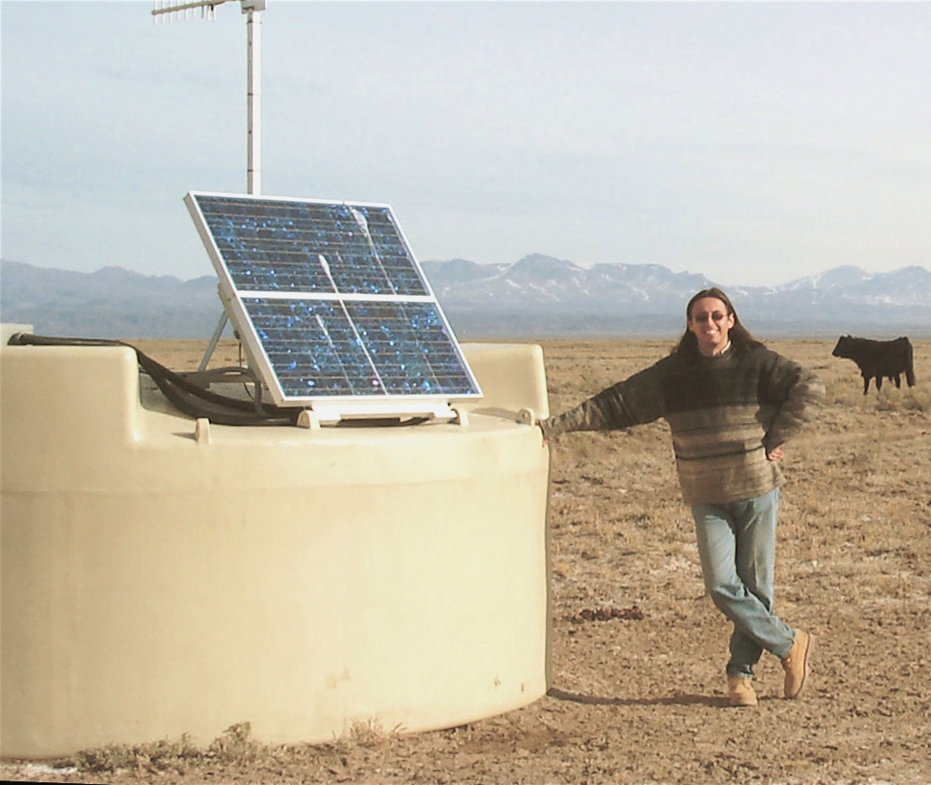 University of Utah physicist Miguel Mostafa stands in Argentina by one of the Pierre Auger Observatory's 1,600 water tanks that detect "air showers" of particles generated when incoming cosmic rays hit Earth's atmosphere. Mostafa and some other Utah physicists are part of a collaboration of scientists from 90 research institutions in 17 nations that studies cosmic rays using the Pierre Auger Observatory. In a new study, the scientists say that ultrahigh-energy cosmic rays -- the most energetic particles in the universe -- come from extremely violent, supermassive black holes in the centers, or nuclei, of certain galaxies.