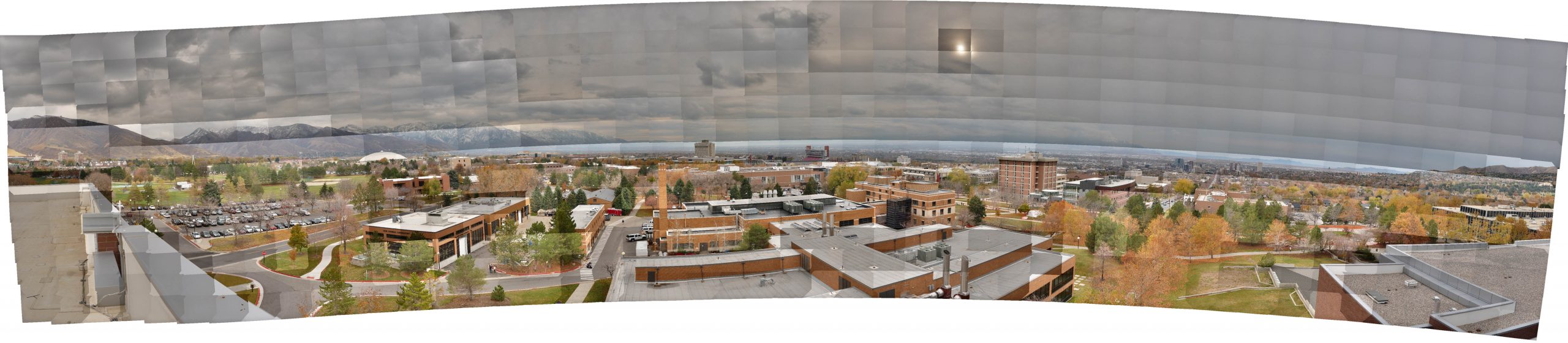 This panoramic mosaic of the Salt Lake Valley was taken by a camera mounted on a robotic panning device atop a University of Utah building. It consists of more than 600 separate photographs that contain a total of 3.27 gigapixels (3.27 billion pixels) of image data. The seams between individual photos are readily apparent, as are differences in light exposure. To edit the photos into a single, seamless, evenly exposed panorama would take hours using normal methods to edit such huge images. The mosaic has been reduced to about 1 megabyte in this image. See next image.